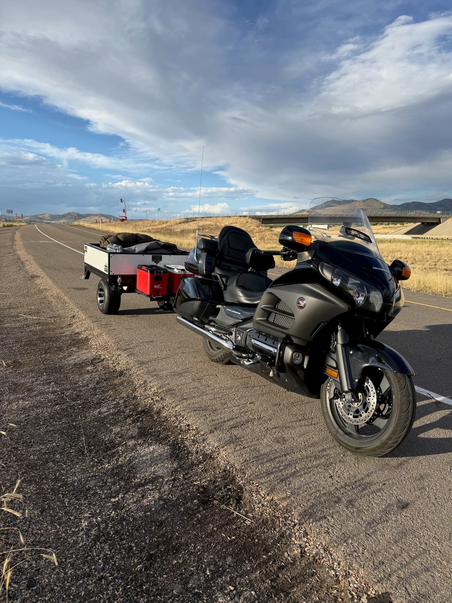 Ultra Compact Conestoga towed behind a Honda Gold Wing on the open highway